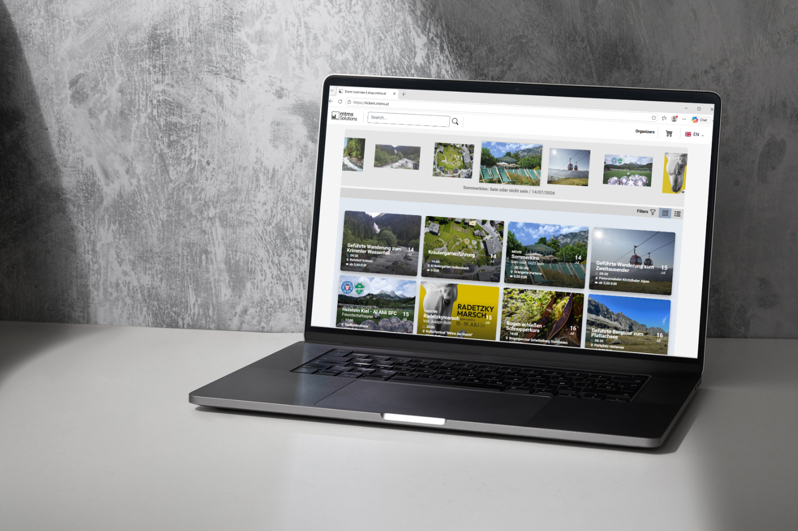 mtms ticketshop Ein geöffneter Laptop, der den mtms Ticketshop anzeigt